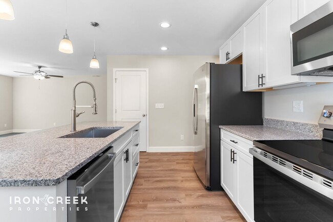 Building Photo - Bright and Modern: New Construction Three-...