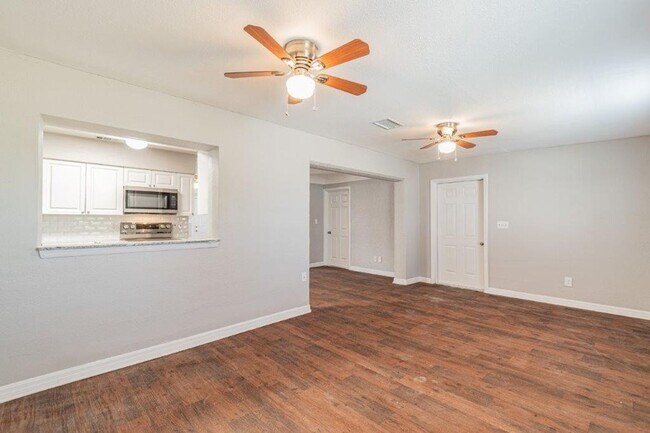 Building Photo - PRICE JUST REDUCED 3/2/1 1389 Sq. Ft. on a huge corner lot with granite & custom tile work!!