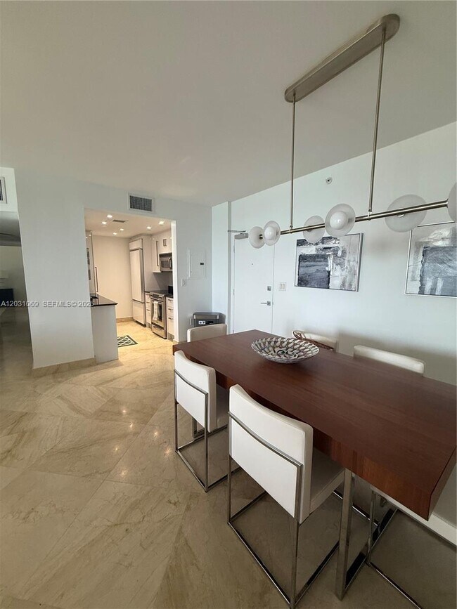 Building Photo - 10275 Collins Ave