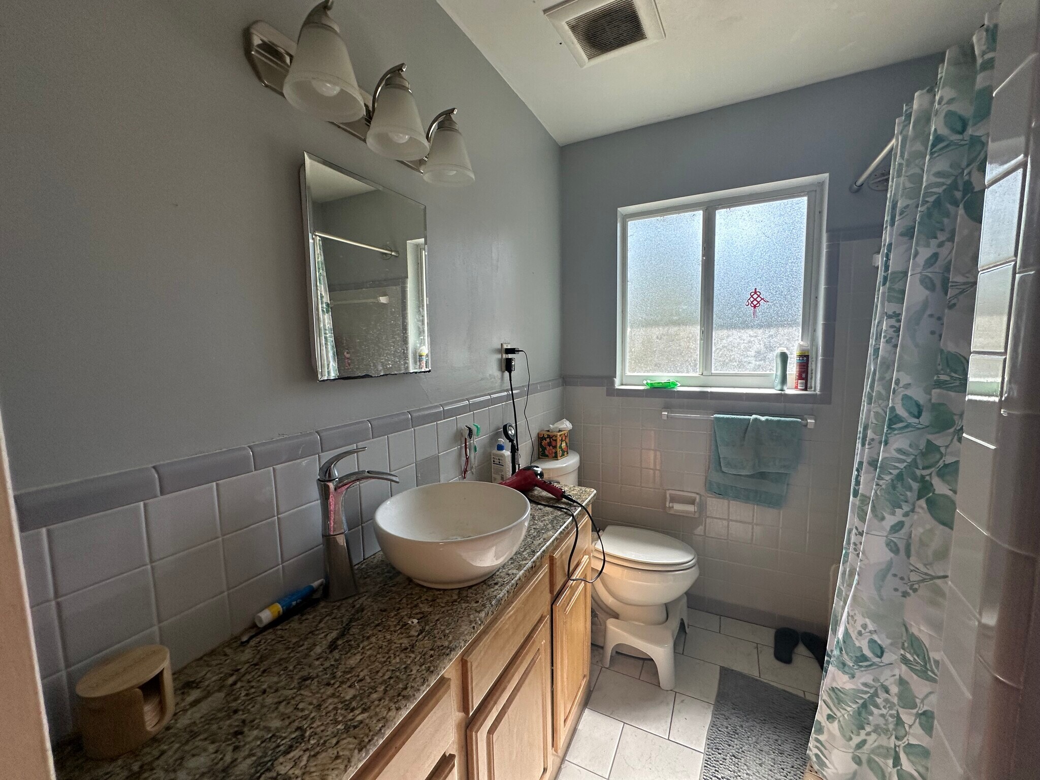 Shared bathroom with updated vanity - 3125 W University Ave