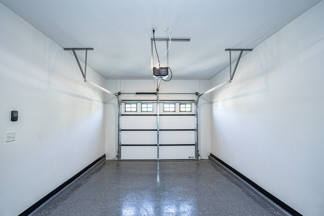 Attached 1-car garage with epoxy floors. - 110 Sierra Cir