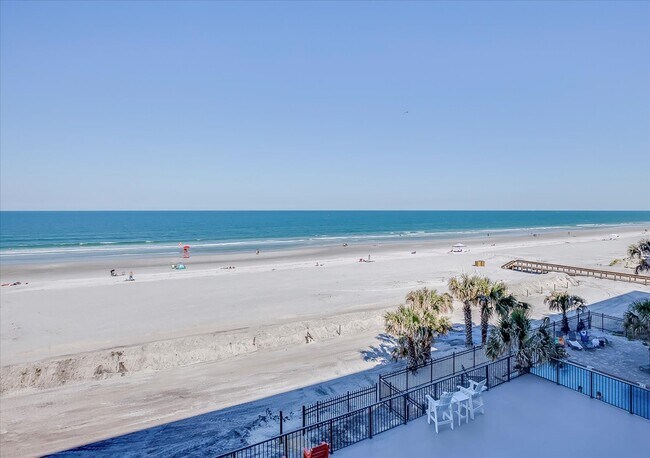 Building Photo - Beachfront Condo with Ocean Views and Acce...