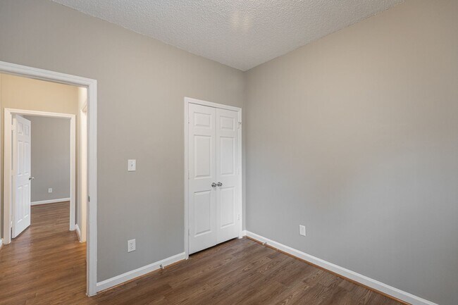 Building Photo - Like New Home off Freeman Mill.  Just Painted, New Wood/Vinyl Flooring, Vaulted Ceilings, Front P...