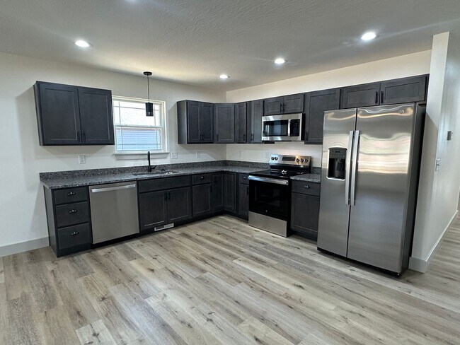 Building Photo - NEW 5 Bed 3 Bath w/ Walk Out Basement Waynesville School District