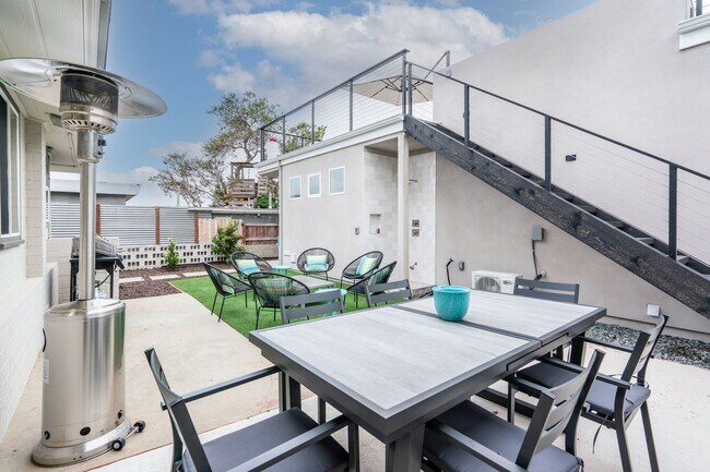 Building Photo - Enjoy stunning sunsets and beach living at its finest, Short Walk to Beach