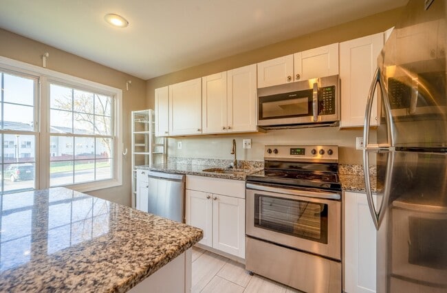 Building Photo - Spacious 3-Level Townhouse with Finished Basement and Fenced Patio