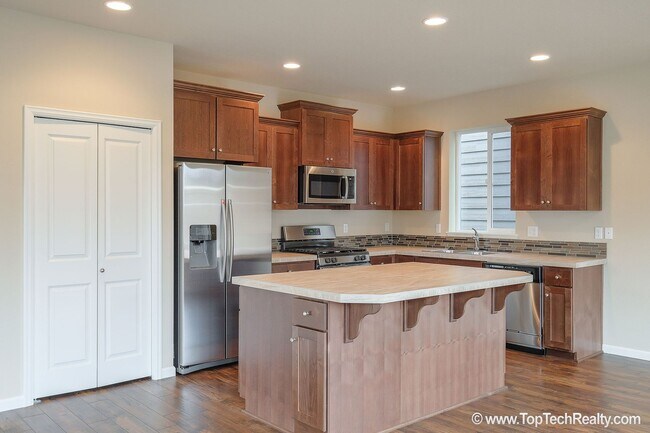 Building Photo - Spacious 4-Bedroom + Office Home in Abbey Creek – Modern Finishes, EV Charger & Low-Maintenance B...