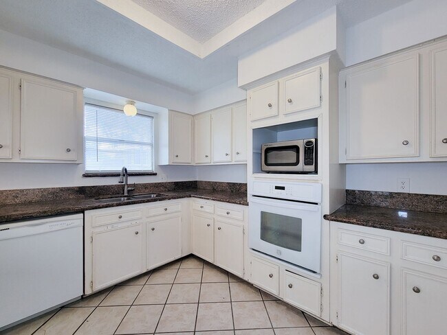 Building Photo - Come and view this open floor plan with much potential. Formal and dining room, granite counters,...