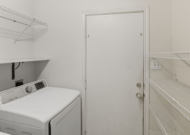 Building Photo - Incredible value with a **washer, dryer, refrigerator, shed, and a covered backyard with a dog run!