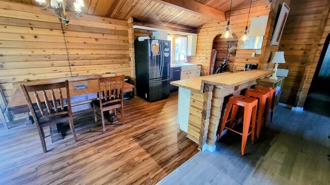 Building Photo - Move-In Ready 2-Bedroom Log Home with Wrap-Around Deck and Enclosed Yard
