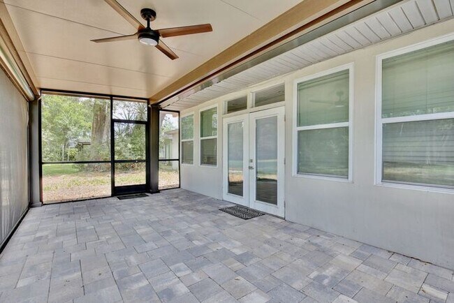 Building Photo - Gorgeous Waterfront 3/2 Mid-century Modern Style Home with a Covered Patio and a Large Backyard i...