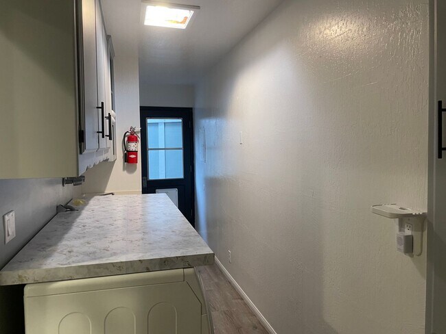 Building Photo - Large home level entry with garage.