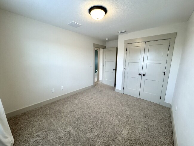 Building Photo - Need Space?  How about 5 bedrooms, 2.5 baths + an extra bonus area upstairs so that the kids can ...
