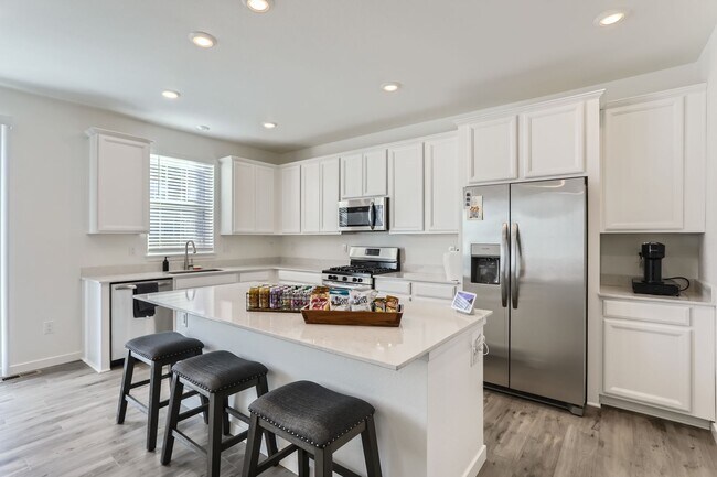 Building Photo - Stunning New Build in Aurora with Sleek Fi...