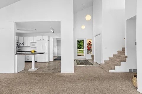 stairs to loft and main entrance - 218 Shore Acres Rd