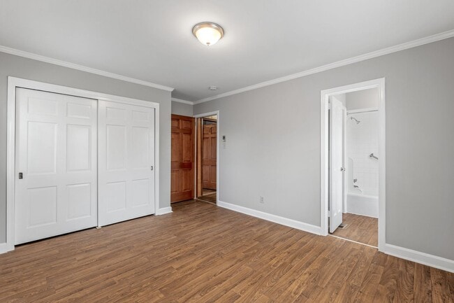 Building Photo - Large Brick Ranch, New Wood Like Flooring Throughout, Just Painted, LR, Den, Sun Room, Carport!