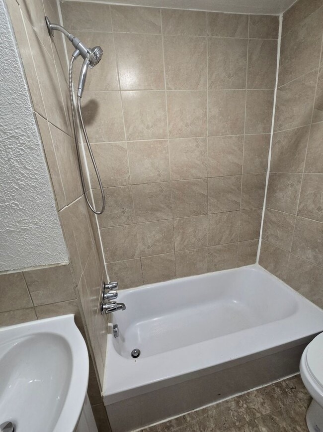Building Photo - This updated and welcoming condo in the he...
