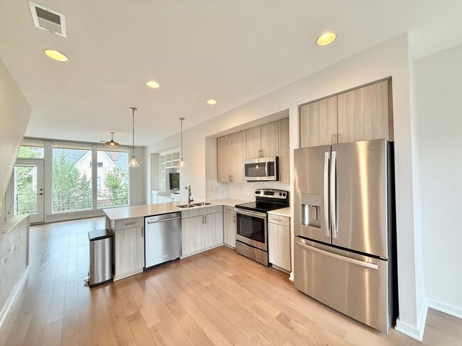 Building Photo - **OFFERING WAIVED APPLICATION FEES** Premier 2BD, 2.5BA Downtown Raleigh Townhome in a Prime Loca...