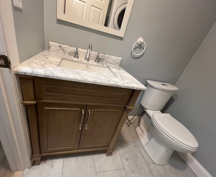 First floor half bath with laundry - 347 Elliot St