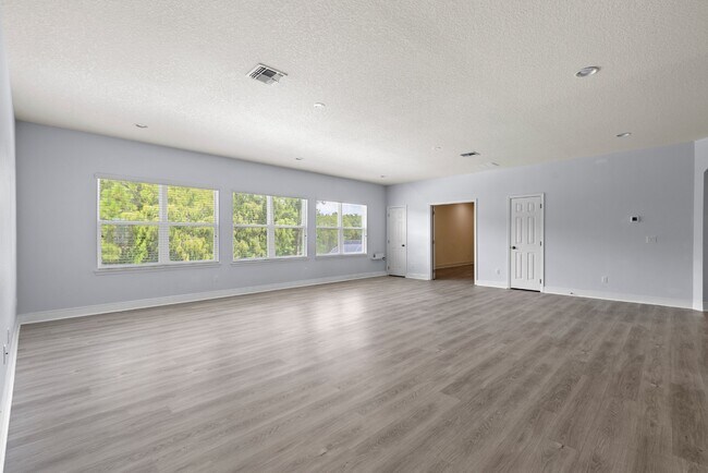 Building Photo - Spacious 6-Bedroom Home Near Lake Nona | 3-Car Garage + Tesla Charger