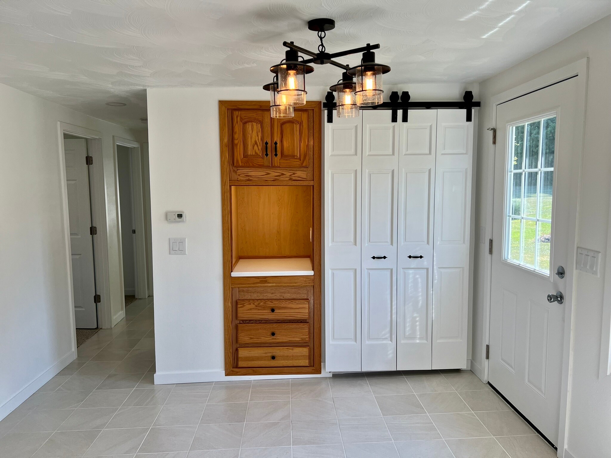 New "coffee bar" area with plug in. White door is washer/dryer hookup - W4493 Spruce Dr