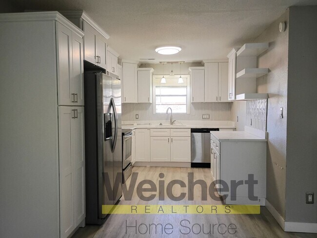 Building Photo - Updated 4-Bed Home with Fenced Yard & Carport