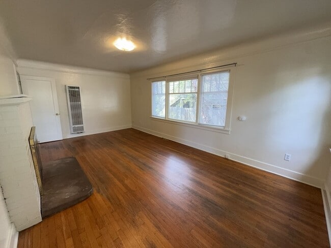 Building Photo - Sit out with your pet on the patio of this...