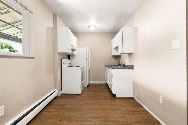 Step into a kitchen that combines style with functionality, offering a serene cooking environment. - 1690 EATON