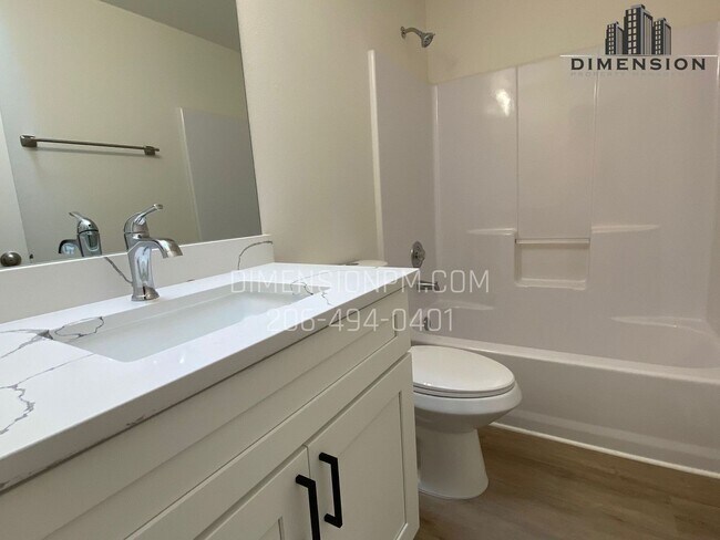 Building Photo - Stylishly Renovated Home with Private Back...