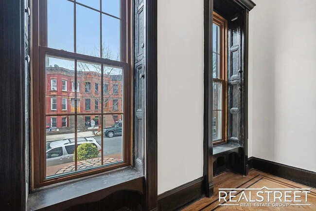 Building Photo - Timelessly Renovated Historic Triplex with...