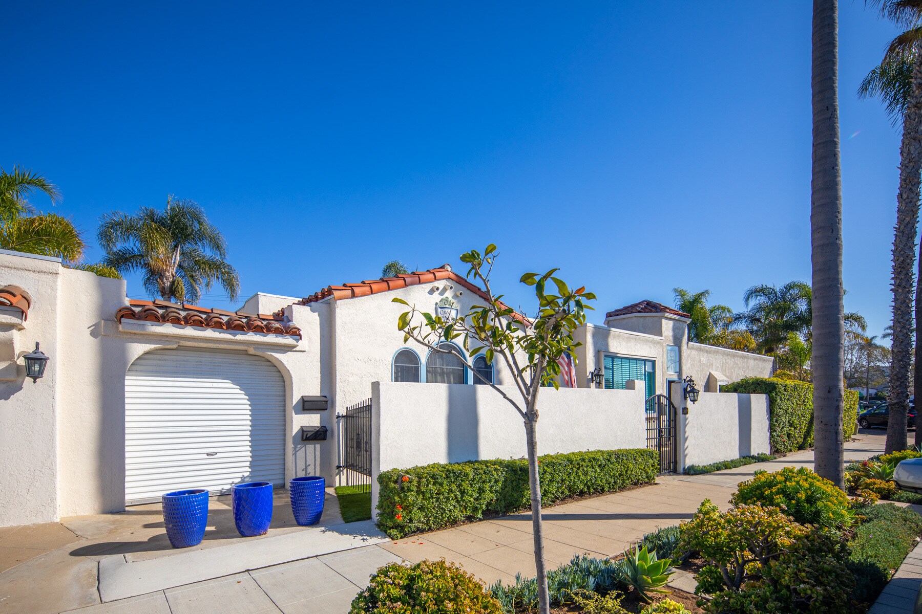 Street front with main house shown to the left of the guest house - 369 Palm Ave