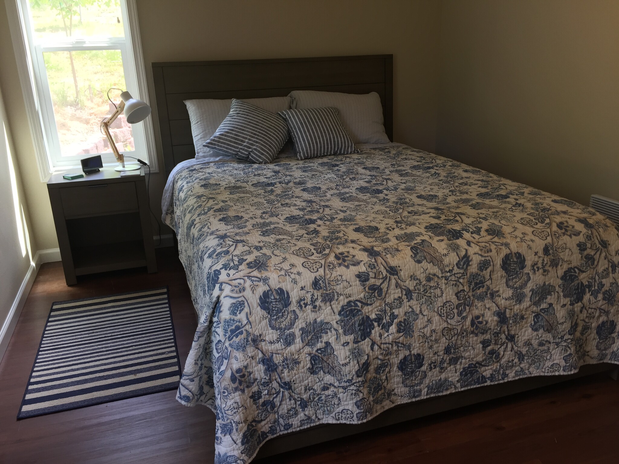 Bedroom with one queen bed. - 123 Lake Louise Dr SW