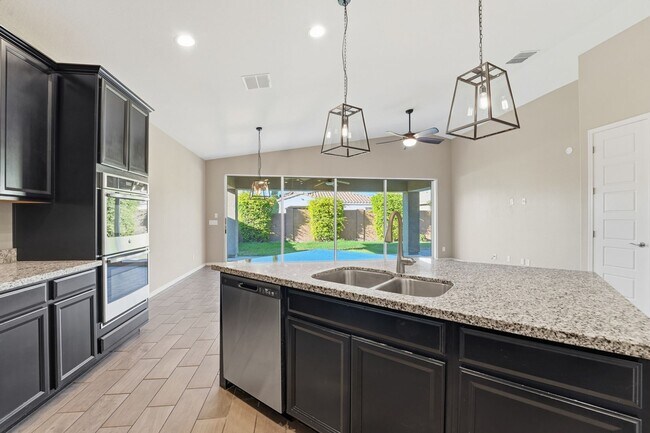 Building Photo - Stunning 4-Bed + Den Eastmark Home with Modern Upgrades Throughout