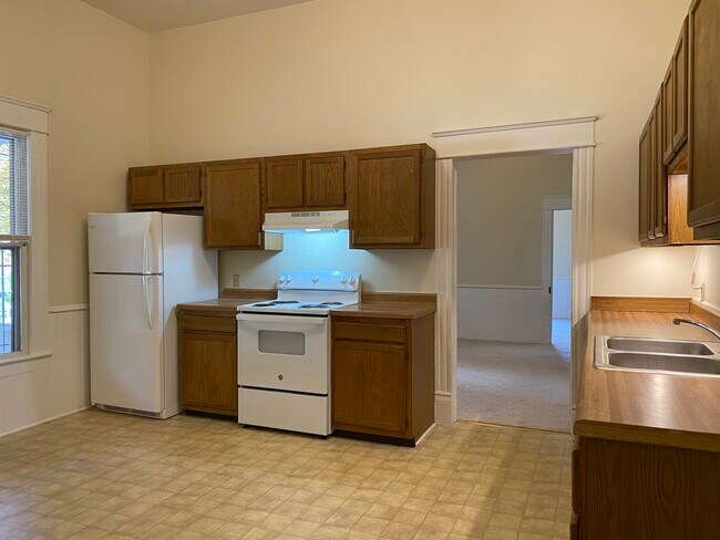 The large office/study is adjacent to the kitchen. - 218 Linden Ave