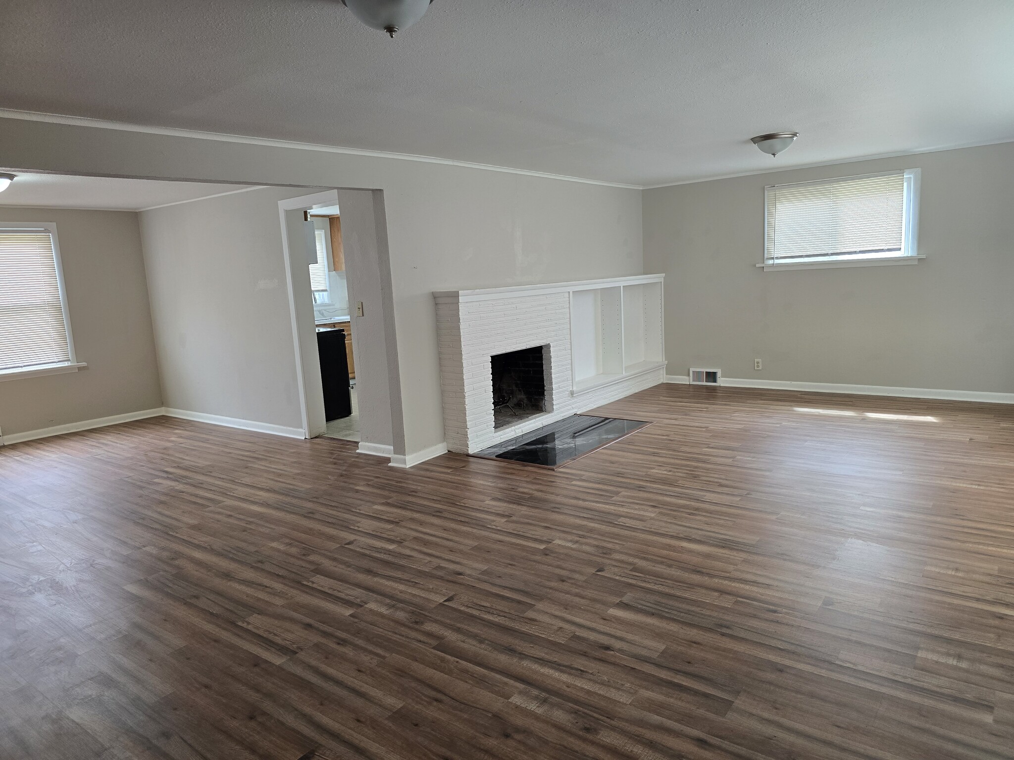 Large living room w/ new plank flooring thru-out. - 12105 12th Ave S
