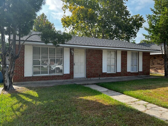 Building Photo - 3 Bedroom, 1.5 Bathroom, Brick Home with yard and Storage Building