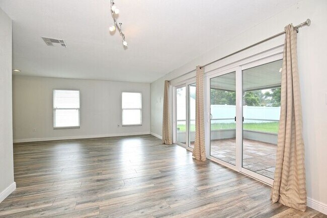 Building Photo - Gorgeous 4/2 Pool Home with a Covered Patio and a Large Fenced Backyard Located in Dr. Phillip's ...