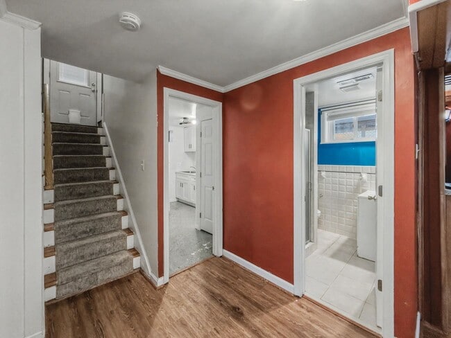 Building Photo - Furnished 4BD 2BA Home with Two kitchens, Basement, and Garage!