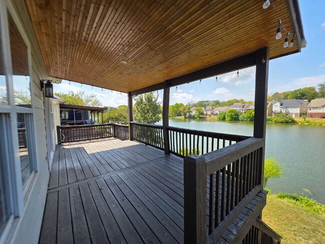 Building Photo - Lakefront 3BR/3BA with Covered Deck, Garage & Community Pool