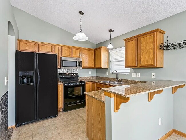 Building Photo - "Spacious 4-Bedroom Family Home with Cozy Fireplace in Wichita - 2261 Sq Ft of Comfort!"