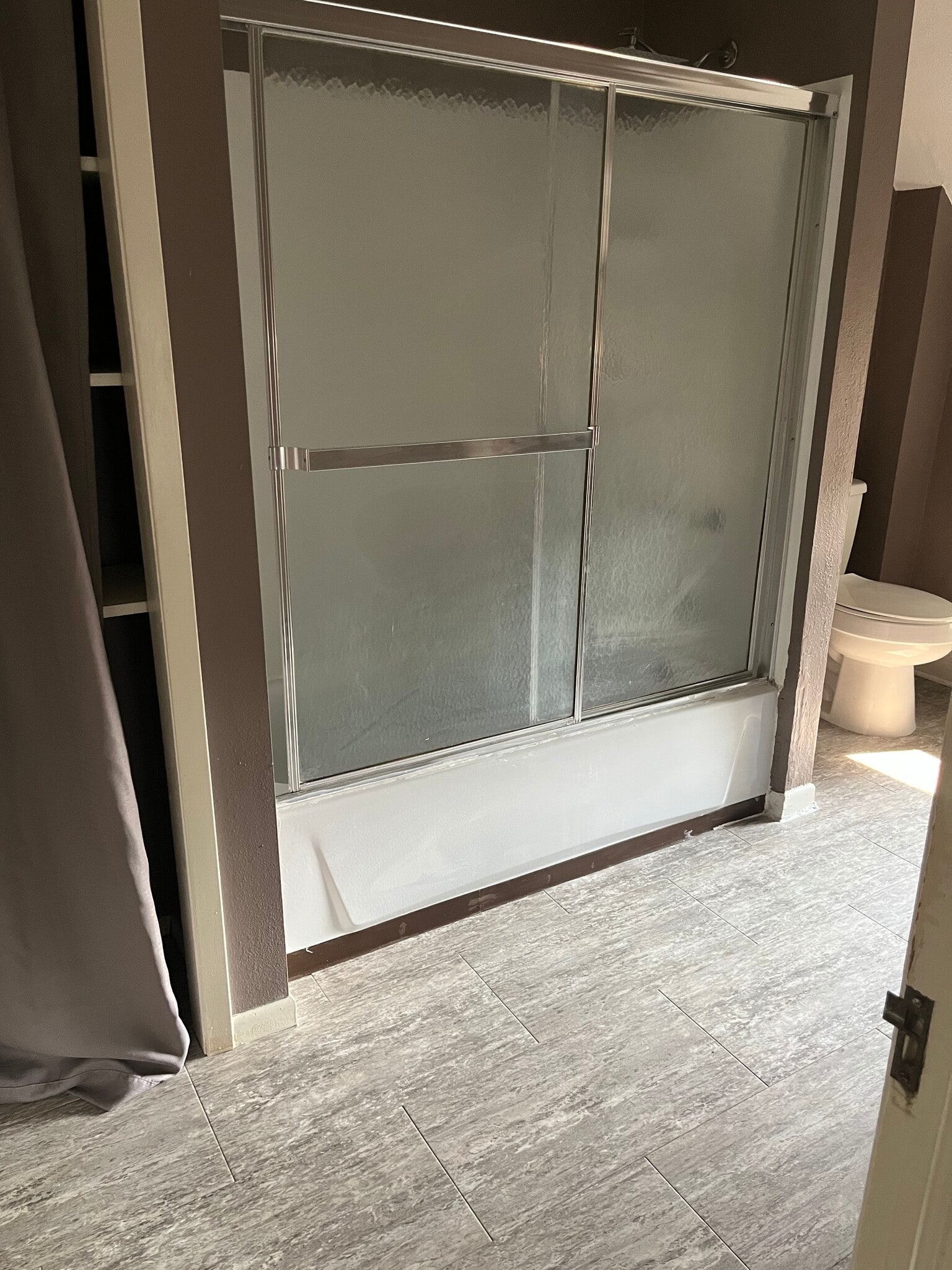 Full bathroom with tub and shower - 725 W 3rd St