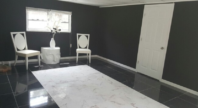 living room with custom marble tile - 399 Ave B Ave SE