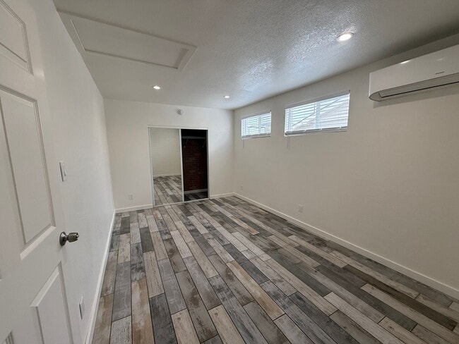 Building Photo - 4 Bedroom Home with Large Backyard | Modern Landscaping | Utilities Included