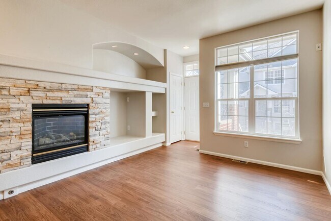 Building Photo - Stunning 3-bed 3-bath townhome that features hardwood floors and an attached 2-car garage!