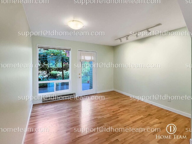 Building Photo - "Charming 2-Bed Townhouse with Gleaming Hardwood Floors in Vibrant Seattle Neighborhood"