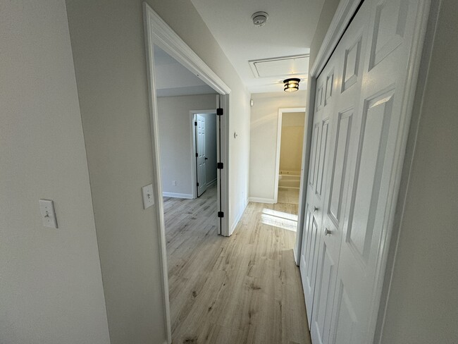 Hallway with laundry - 8017 Pine Oak Rd