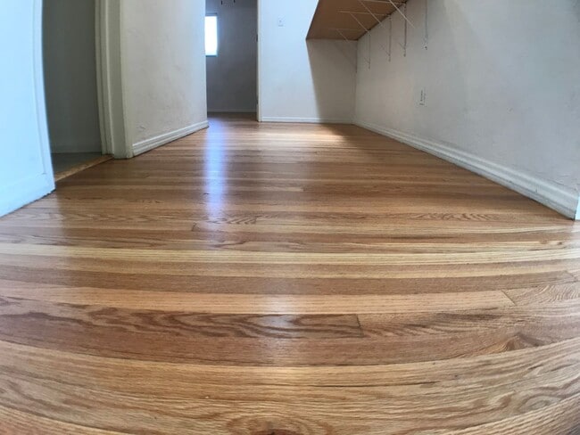 Building Photo - BEAUTIFUL WOOD FLOORS IN THIS 5 BED 2 BATHROOM HOUSE- LARGE DOGS OK