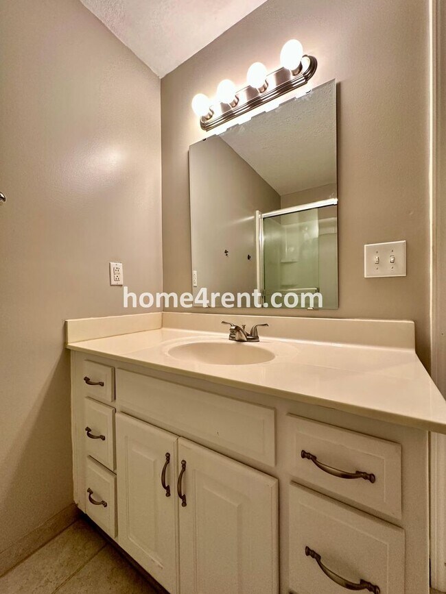 Building Photo - Beautiful Four-Bedroom Home with Three Car Garage, Wood Floors, Finished Basement and a Fenced Ya...