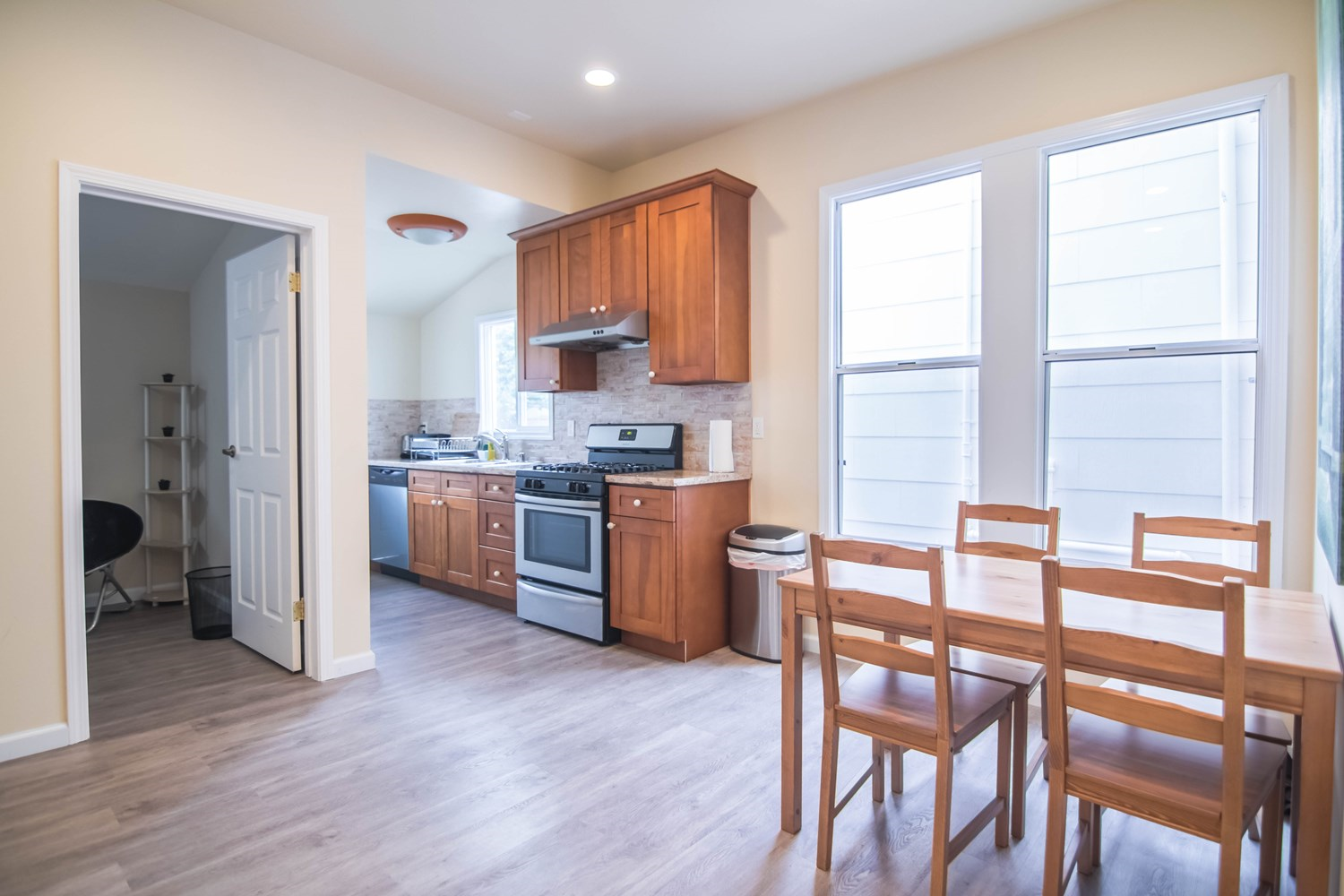 Kitchen with gas stove and dishwasher, next to open concept dining area - 267 Irvington Street