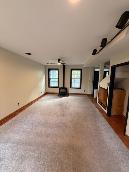 Windows face Hudson, Gas heater for cozy warmth and ceiling fan above - 327 Hudson Ave